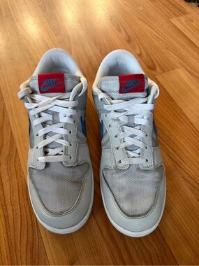 Nike White Sneakers with Blue Swoosh and Red Tongues